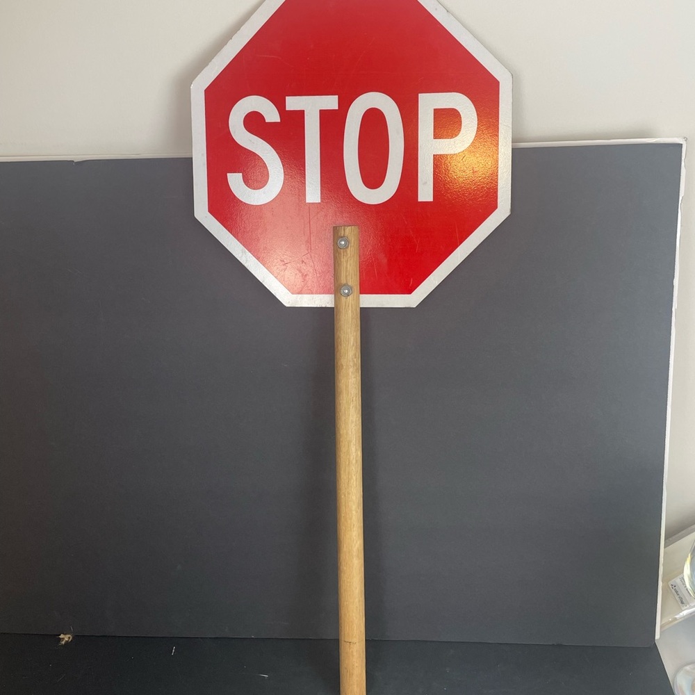 Red Stop Sign with Wooden Handle